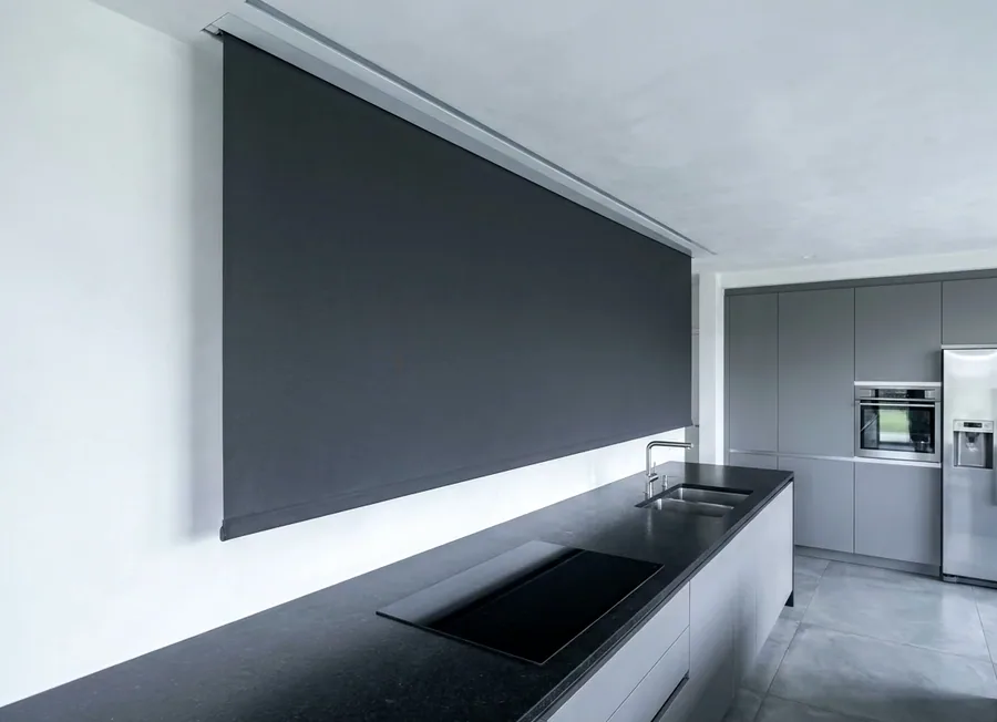 Concealed blind dropping from a recessed ceiling slot in a modern Fourways kitchen