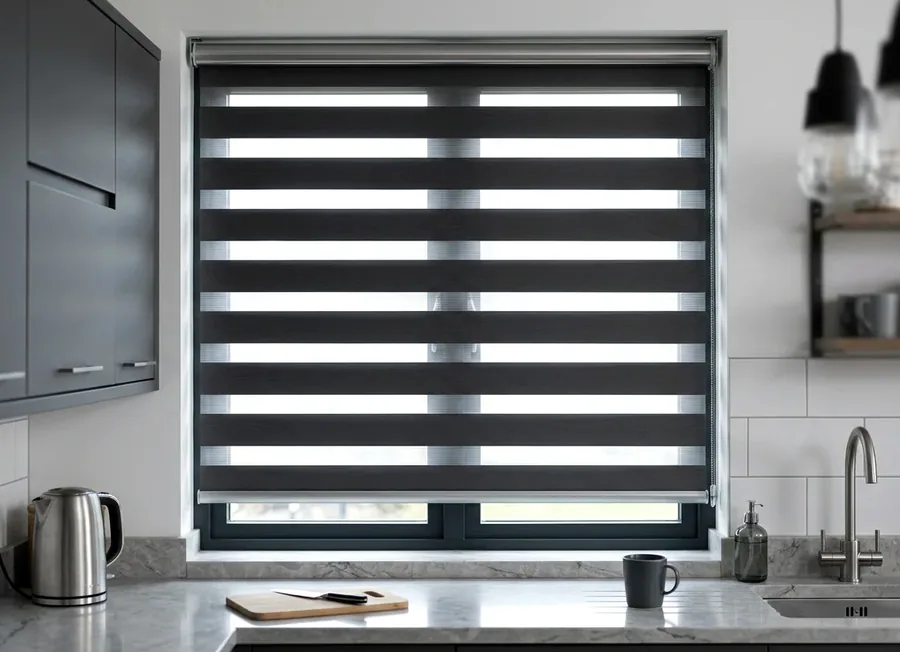 Day-night zebra blind with alternating sheer and solid bands over a Fourways kitchen window